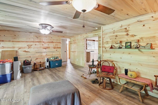 180 Stevenson Branch Rd, Middlesboro, KY 40965 - living area featuring a ceiling fan, wood walls, wood ceiling, and hardwood / wood-style floors