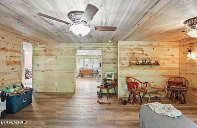 180 Stevenson Branch Rd, Middlesboro, KY 40965 - living area featuring wooden ceiling, a ceiling fan, wood walls, and wood finished floors