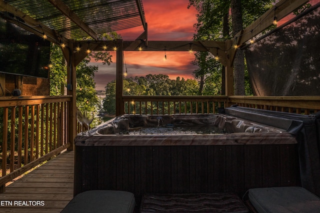 1917 Bootbluff Trl, Dandridge, TN 37725 - deck at dusk featuring a hot tub and a pergola