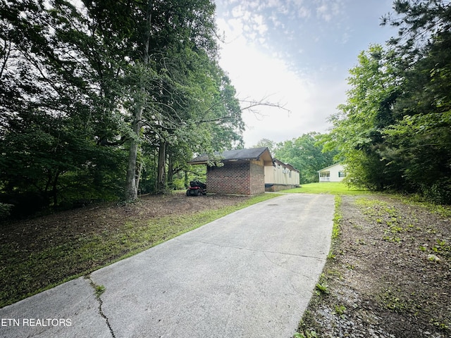 1238 Double S Rd, Dayton, TN 37321 - view of home's exterior with concrete driveway and brick siding