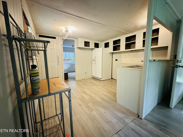 1238 Double S Rd, Dayton, TN 37321 - kitchen with light wood finished floors, white refrigerator with ice dispenser, and open shelves