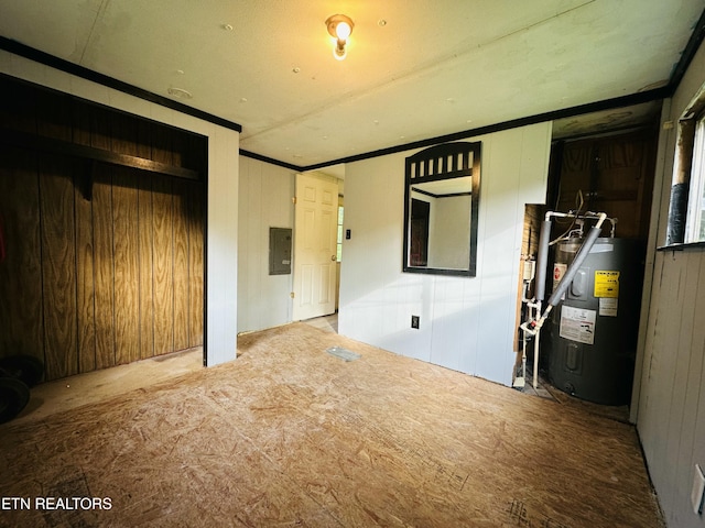1238 Double S Rd, Dayton, TN 37321 - empty room with water heater, wooden walls, ornamental molding, and electric panel