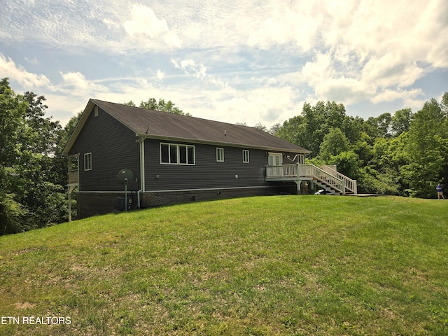 241 Oswego Rd, Jellico, TN 37762 - rear view of property featuring a wooden deck, a lawn, crawl space, and stairway