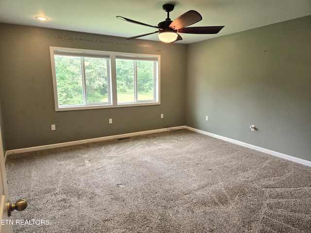 241 Oswego Rd, Jellico, TN 37762 - spare room with a ceiling fan, baseboards, and carpet