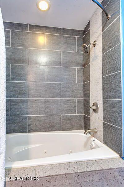 241 Oswego Rd, Jellico, TN 37762 - bathroom featuring a combined bath / shower with jetted tub