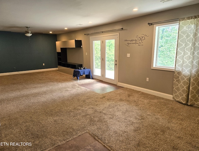 241 Oswego Rd, Jellico, TN 37762 - unfurnished living room featuring a ceiling fan, recessed lighting, tile patterned flooring, carpet flooring, and baseboards