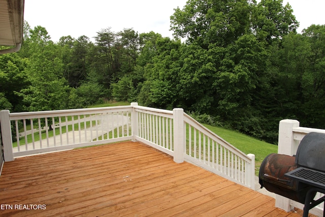 241 Oswego Rd, Jellico, TN 37762 - wooden deck featuring a lawn