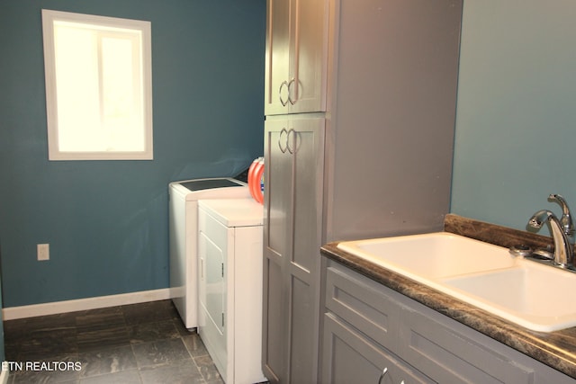 241 Oswego Rd, Jellico, TN 37762 - clothes washing area featuring independent washer and dryer, cabinet space, and baseboards