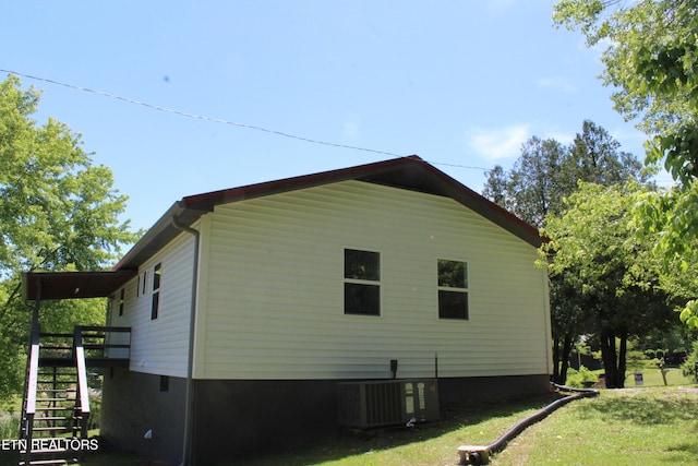 515 Silver Lake Dr, Jamestown, TN 38556 - view of side of property featuring central AC, stairway, a lawn, a wooden deck, and crawl space