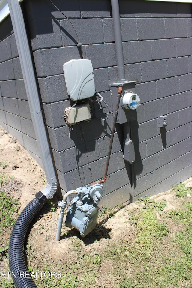 515 Silver Lake Dr, Jamestown, TN 38556 - exterior view of concrete block siding and electric meter