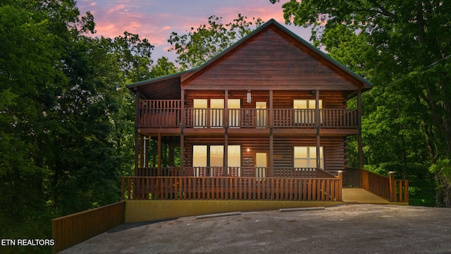 view of front of house featuring a balcony