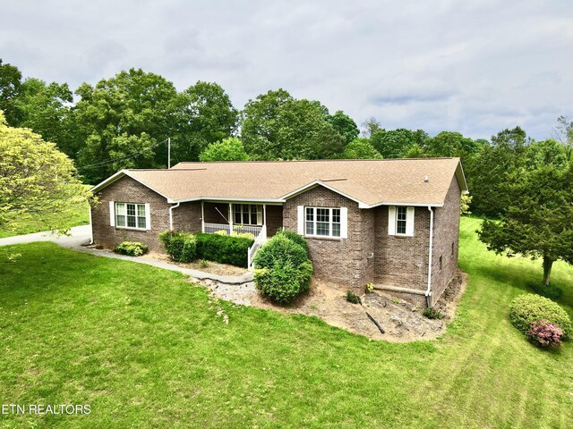 200 Harmon Cir, New Tazewell, TN 37825 - single story home featuring a front lawn, roof with shingles, and brick siding