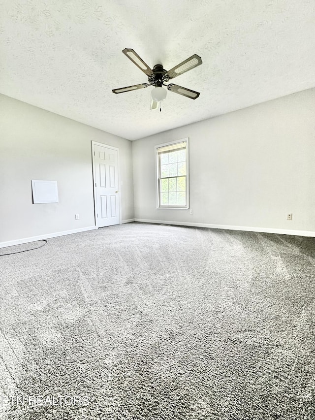 200 Harmon Cir, New Tazewell, TN 37825 - carpeted spare room with baseboards, a textured ceiling, and ceiling fan