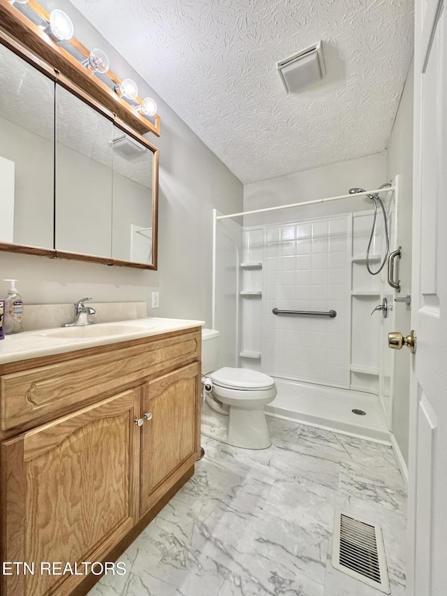 200 Harmon Cir, New Tazewell, TN 37825 - full bathroom featuring a shower stall, toilet, marble look tile flooring, vanity, and a textured ceiling