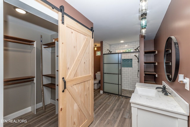 1431 Remsen St, Alcoa, TN 37701 - bathroom with vanity, toilet, a shower stall, wood finished floors, and recessed lighting