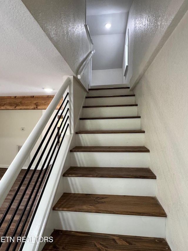 4540 S York Hwy, Jamestown, TN 38556 - stairs featuring a textured wall and wood finished floors