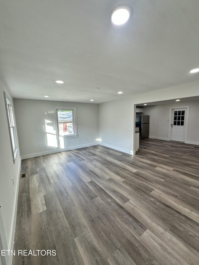 3824 Catalpa Ave, Knoxville, TN 37914 - unfurnished living room featuring baseboards, wood finished floors, and recessed lighting