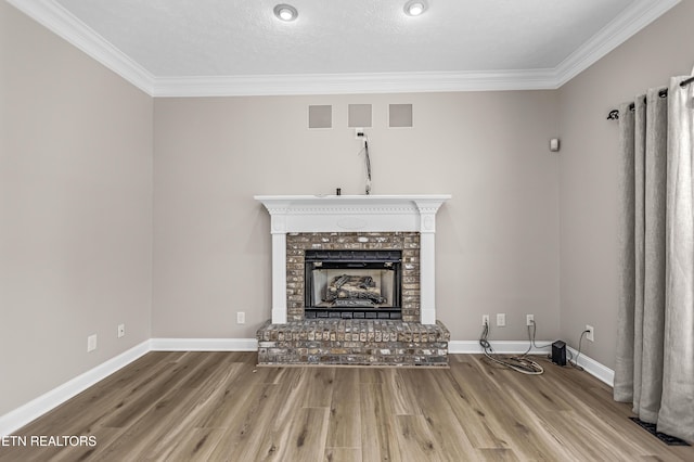 117 Mayview Dr, Powell, TN 37849 - unfurnished living room featuring wood finished floors, a brick fireplace, crown molding, and baseboards