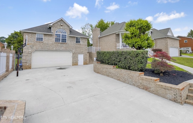 117 Mayview Dr, Powell, TN 37849 - traditional home with an attached garage, concrete driveway, and brick siding