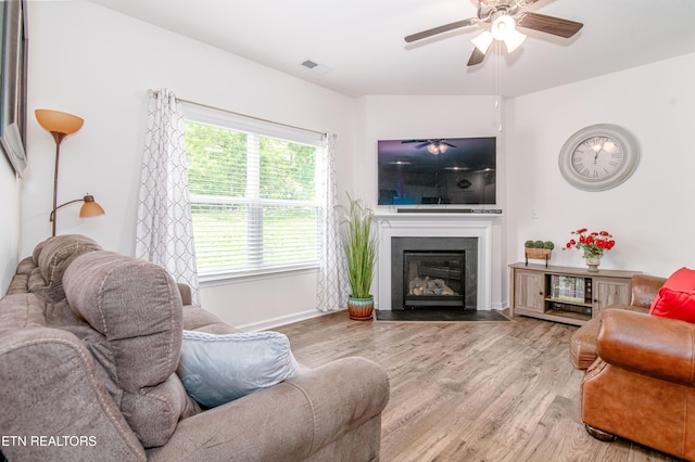 548 Cliff St, Morristown, TN 37814 - living room with a ceiling fan, a fireplace with flush hearth, and wood finished floors