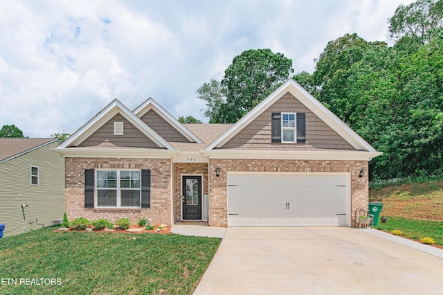 548 Cliff St, Morristown, TN 37814 - craftsman-style home with brick siding, concrete driveway, a front lawn, and a garage