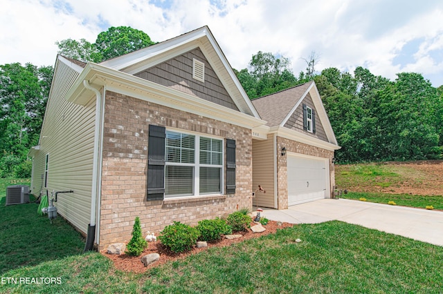 548 Cliff St, Morristown, TN 37814 - craftsman-style home featuring brick siding, driveway, a garage, a front lawn, and central AC unit