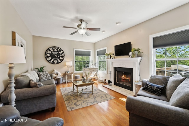 221 Stony Rock Ln, Jacksboro, TN 37757 - living room with ceiling fan, a fireplace, and wood finished floors