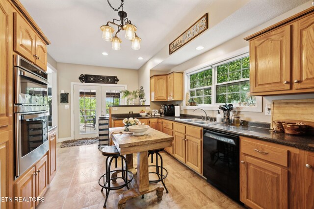 221 Stony Rock Ln, Jacksboro, TN 37757 - kitchen with black dishwasher, a sink, stainless steel double oven, a chandelier, and french doors