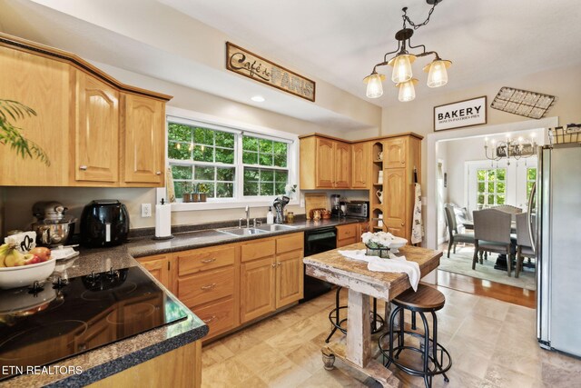 221 Stony Rock Ln, Jacksboro, TN 37757 - kitchen featuring a chandelier, black appliances, a sink, and healthy amount of natural light