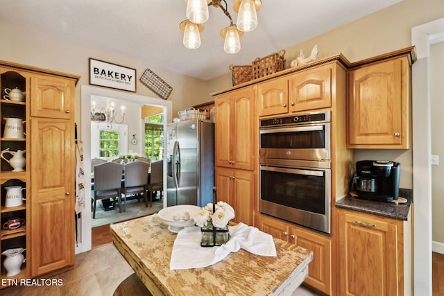 221 Stony Rock Ln, Jacksboro, TN 37757 - kitchen with a chandelier and appliances with stainless steel finishes