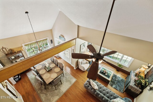 221 Stony Rock Ln, Jacksboro, TN 37757 - living room with a chandelier, wood finished floors, ceiling fan, and vaulted ceiling