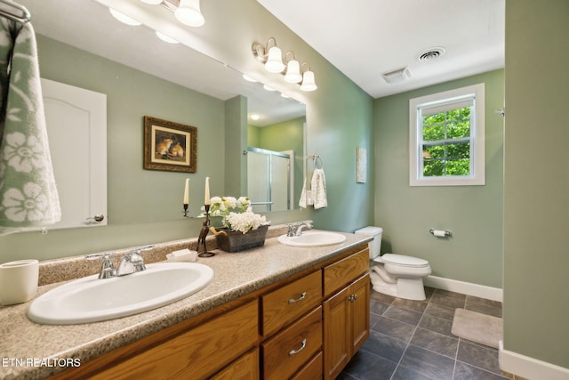 221 Stony Rock Ln, Jacksboro, TN 37757 - bathroom featuring a stall shower, double vanity, toilet, and baseboards
