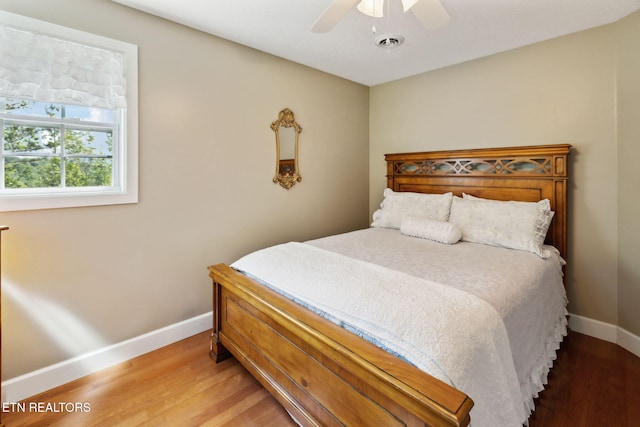 221 Stony Rock Ln, Jacksboro, TN 37757 - bedroom featuring baseboards, wood finished floors, and ceiling fan