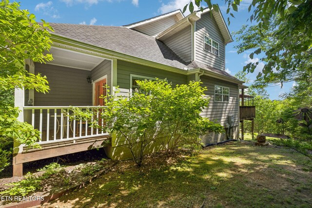 221 Stony Rock Ln, Jacksboro, TN 37757 - view of side of home featuring a shingled roof
