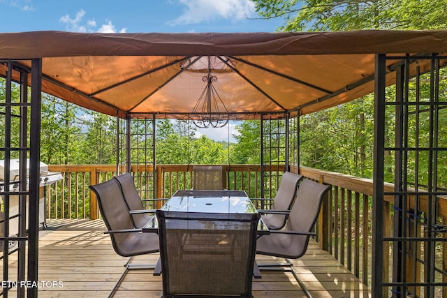 221 Stony Rock Ln, Jacksboro, TN 37757 - wooden terrace with outdoor dining area, a gazebo, and a grill