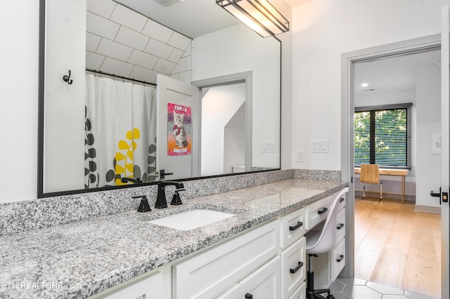 8539 N Ruggles Ferry Pike, Strawberry Plains, TN 37871 - bathroom with vanity, curtained shower, and wood finished floors