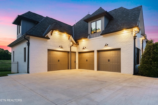 8539 N Ruggles Ferry Pike, Strawberry Plains, TN 37871 - view of front of home with concrete driveway, brick siding, an attached garage, and roof with shingles