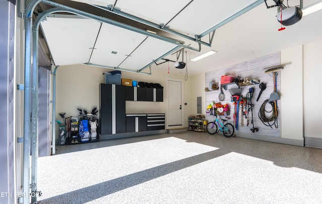 8539 N Ruggles Ferry Pike, Strawberry Plains, TN 37871 - garage featuring electric panel and a garage door opener