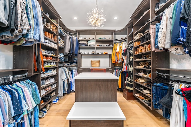 8539 N Ruggles Ferry Pike, Strawberry Plains, TN 37871 - walk in closet with a chandelier and light wood finished floors