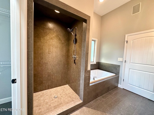 129 Canary Ct, Crossville, TN 38555 - full bathroom featuring a tile shower, a garden tub, and a walk in closet