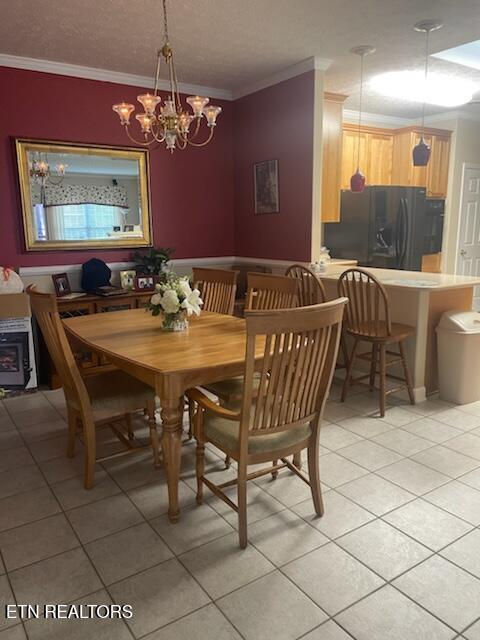 203 Hawthorn Loop, Crossville, TN 38555 - dining space with light tile patterned flooring, crown molding, and a chandelier