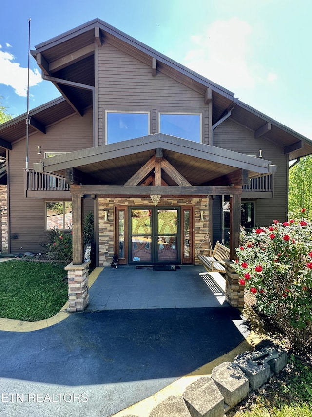 189 Bridle Way, Speedwell, TN 37870 - doorway to property featuring stone siding and covered porch