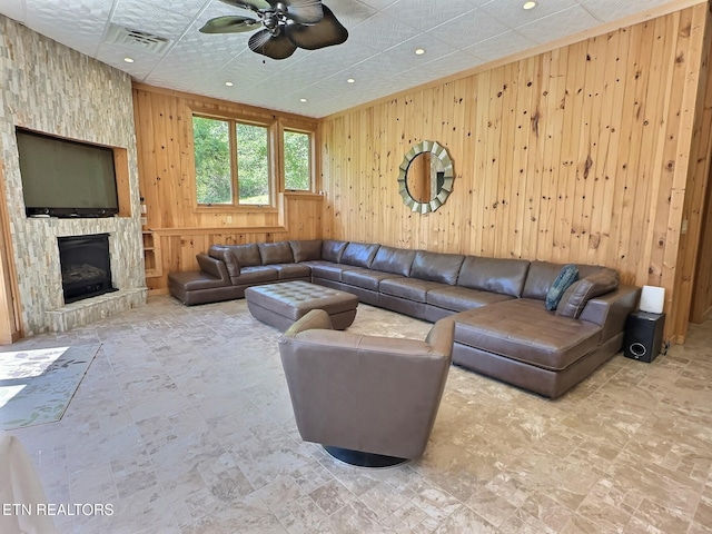 189 Bridle Way, Speedwell, TN 37870 - living area featuring wood walls, a ceiling fan, recessed lighting, and a fireplace