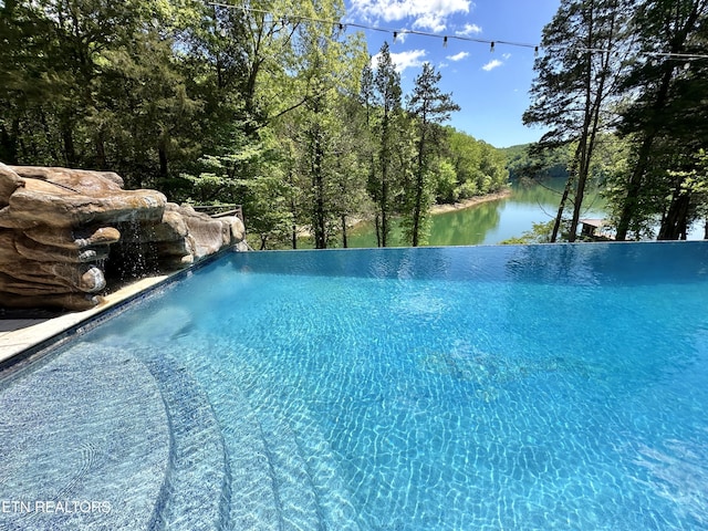 189 Bridle Way, Speedwell, TN 37870 - view of pool featuring an infinity pool, a water view, and a wooded view