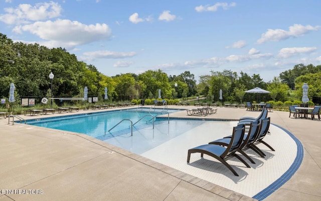 12713 Duckfoot Ln, Farragut, TN 37934 - community pool with fence, a patio area, and view of scattered trees