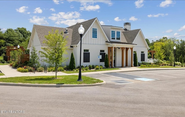 12713 Duckfoot Ln, Farragut, TN 37934 - view of front of property featuring a chimney, board and batten siding, roof with shingles, and uncovered parking