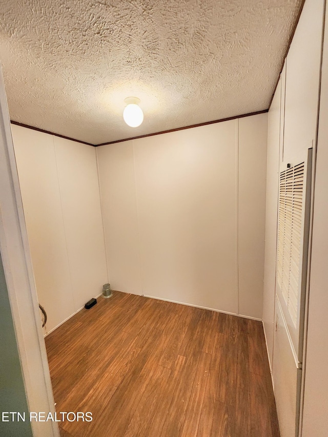 334 Corrington Ln, Lafollette, TN 37766 - empty room with a heating unit, wood finished floors, a decorative wall, and a textured ceiling