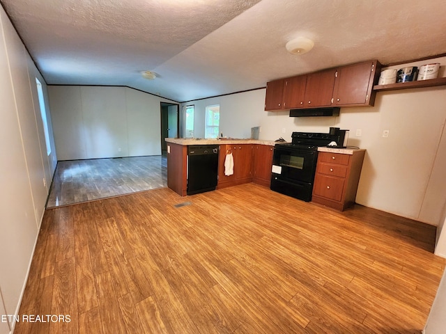 334 Corrington Ln, Lafollette, TN 37766 - kitchen featuring black appliances, a peninsula, light wood-style flooring, under cabinet range hood, and light countertops