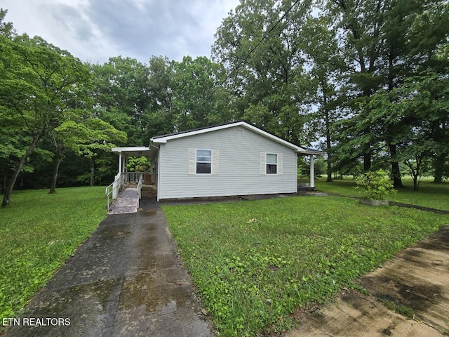 288 Andy Ln, Winfield, TN 37892 - view of home's exterior featuring a lawn and concrete driveway