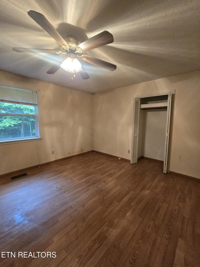 288 Andy Ln, Winfield, TN 37892 - unfurnished bedroom featuring dark wood finished floors, a ceiling fan, and baseboards
